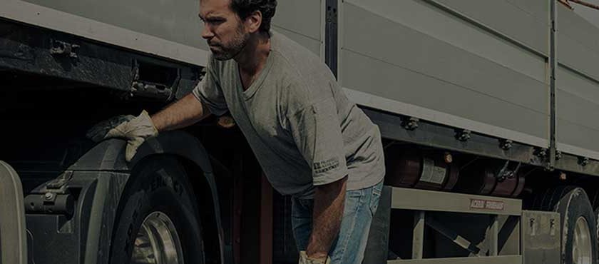 mechanic inspecting a trailer | Pomona Trucks
